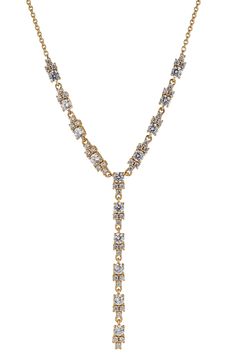 Anchor your stack in serious shine wit this dainty Y-necklace fronted by clusters of cubic zirconia. Rhodium plate or 18k-gold plate/cubic zirconia Imported Elegant Gold Crystal Lariat Necklace, Gold Crystal Lariat Necklace, Gold Crystal Backdrop Necklace With Adjustable Chain, Gold Crystal Backdrop Necklace For Formal Occasions, Formal Gold Crystal Backdrop Necklace, Gold Cubic Zirconia Lariat Backdrop Necklace, Gold Lariat Necklace With Diamond Accents For Wedding, Party Lariat Necklace With Adjustable Cubic Zirconia Chain, Gold Crystal Backdrop Necklace For Gifts