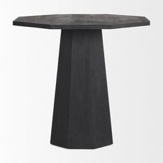 a black table sitting on top of a white floor