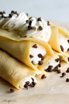 three crepes with chocolate chips and whipped cream