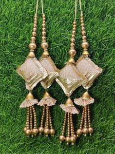 Indian Handmade Gold Latkan for Saree Blouse Lehenga HandBags Dupatta Decoration Bridal Wedding dress for Women pair of 2 pcs Size - 21.0 cm Length  Item Description You can use this Beautiful pair of tassle for several DIY projects.  *These beautiful Tassel Latkans are used as the accessory for saree blouse on the back, but u can use according to your need and your innovative ideas. * Package contains 2 Latkan / 1 Pair Other Than Saree Blouse, you can use these latkans in various ways Craft Projects Designing Home Decoration Festive celebrations. Evening and party Apparels. Home décor items Apparel & Fashion Scarves n Stoles Headband, hats Table cover, curtains, Pillow covers, Cushion cover Shoe designing Headband, hats Table cover, curtains Designing stylish blouses Ship From New Delhi, Luxury Gold Necklaces With Latkans, Luxury Saree With Latkans For Festivals, Luxury Jewelry With Latkans For Rituals, Luxury Chandbalis With Latkans, Latkan Tassels Blouses Big And Heavy Accessories, Women's Blouse Piece With Latkans For Traditional Ceremonies, Luxury Latkans Necklaces For Women, Cheap Gold Chandbalis With Latkans, Luxury Latkans Necklace For Wedding