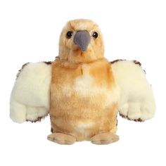 a stuffed bird with large wings on it's back legs and eyes, sitting upright