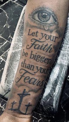 a man's arm with an eye and the words let your faith be bigger than you