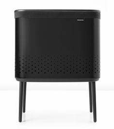 Looking for a beautiful laundry solution for your busy family home? The Brabantia Bo Laundry Hamper marries beautiful design with practicality. It fits flat against the wall, and the adjustable long non-skid legs make it very stable. Thanks to the clever Quick-Drop opening, you don't even have to open the lid when you put items in the hamper. Handy! Brabantia 16-Gallon Black Steel Laundry Hamper Cotton | 200526 Laundry Hamper Storage, Laundry Bin, Laundry Solutions, Hamper Storage, Nordic Minimalism, Laundry Supplies, Busy Family, Laundry Hamper, House Doctor