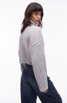 A chunky rib adds extra cozy points to a wool-kissed sweater knit to a cute, cropped length. 22" length (size Medium) Turtleneck Long sleeves 95% polyester, 5% wool Machine wash, line dry Imported Cropped Textured Knit Sweater For Fall, Fall Cropped Textured Knit Sweater, Ribbed Knit Turtleneck Cropped Sweater, Cozy Ribbed Cropped Sweater For Fall, Trendy Winter Cropped Sweater In Chunky Knit, Cozy Cropped Knit Sweater, Trendy Ribbed Turtleneck Cropped Sweater, Trendy Ribbed Knit Cropped Sweater, Fall Cropped Knit Sweater