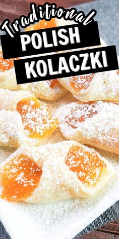 some powdered sugar and jelly pastries on a plate with the words traditional polish kolaczki