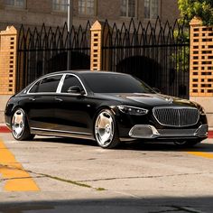 a black car parked in front of a building