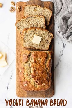 sliced banana bread on a cutting board with butter