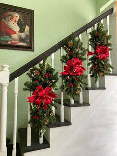 christmas decorations on the banisters are decorated with holly and poinsettis