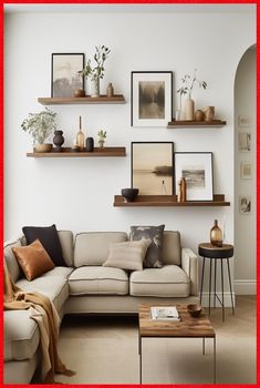 a living room filled with furniture and pictures on the wall above it's shelves