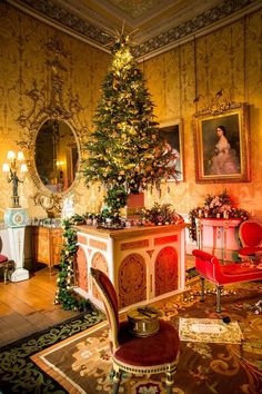 a living room with a christmas tree in the corner