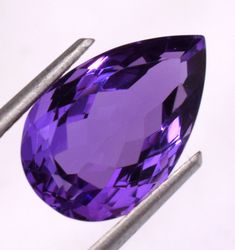 Natural Certified Pear Cut Purple Amethyst 6.50 Ct Loose Gem Stone for ring use GEMSTONE INFORMATION: GEM: NATURAL AMETHYST COLOR: PURPLE MEASUREMENT: 15.05 x 9.71 x 7.55 MM CARAT WEIGHT: 6.50 CT SHAPE: PEAR TREATMENT: NO DISPERSION: Excellent LUSTER: Excellent CONFLICT FREE Every gemstone featured on Pristine Custom Rings is hand selected from around the world and inspected prior to shipment. We own each and every one of these gemstones featured. All of our gemstones are Conflict Free. Diamond Drawing, Amethyst Color, Gem Stone, Pear Cut, Purple Amethyst, Custom Rings, Color Purple, Pear, Amethyst