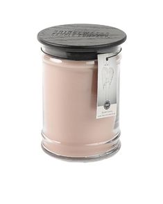 a pink candle with a black lid on a white background