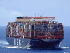 a large cargo ship in the middle of the ocean