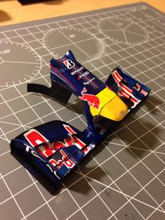 a red bull racing car is on a cutting board and ready to be cut into pieces