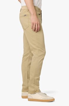 Always trendy, these slim-cut pants are made from a softened cotton blend and garment-dyed in a solid hue for versatility. 29" inseam; 11" rise (size 32) Zip fly with button closure Five-pocket style 99% cotton, 1% elastane Machine wash, tumble dry Imported Model stats: 6'1" height, 32" waist. Model is wearing size 32. Spring Slim Fit Bottoms With 5-inch Inseam, Fitted Cotton Pants With 5-inch Inseam, Slim Fit Bottoms With 5-inch Inseam For Spring, Spring Tapered Leg Bottoms With Zip Fly, Slim Fit Spring Pants With Standard Cut Leg, Straight Cotton Jeans With Zip Fly, Tapered Cotton Pants In Solid Color, Spring Slim Fit Bottoms With Zip Fly, Fitted Cotton Pants With Five Pockets