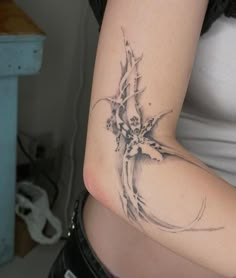 a woman with a flower tattoo on her arm