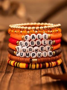 stack of bracelets with words written on them