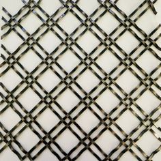 a close up view of an iron mesh fence