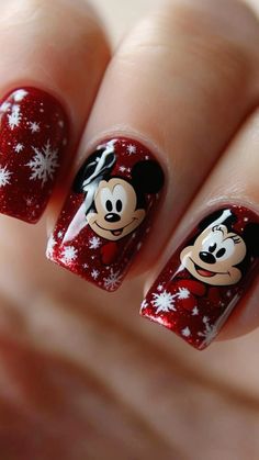 Get into the holiday spirit with these enchanting Disney Christmas nails! Featuring beloved characters like Mickey, Minnie, and more, these festive designs combine classic Christmas elements—think snowflakes, ornaments, and candy canes—with whimsical Disney charm. Perfect for holiday parties or cozy nights in, these nails are a fun way to celebrate the season while showcasing your love for Disney magic. Whether you prefer glitter, bold colors, or subtle accents, there's a design for every Disney fan to enjoy this Christmas! Disney Christmas Nails, Festive Holiday Nails, Subtle Nail Art, Christmas Nail Ideas, Festive Manicure, Nail Looks, Festive Nail Art, Perfect Manicure