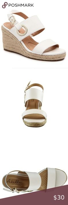 Abella Taya Wedge Sandal Elevate your entire ensemble when wearing the Taya wedge sandal from Abella. The towering espadrille heel and gold hardware will pair with a flirty dress and floppy hat!   Faux leather upper Slingback strap Adjustable buckle strap closure Synthetic lining Synthetic outsole 3.25" wedge heel  Fits true to size, very comfortable Abella Shoes Wedges White Open Toe Synthetic Espadrilles, Chic White Synthetic Espadrilles, White Synthetic Espadrilles With Ankle Strap, White Synthetic Platform Espadrilles, White Platform Espadrilles In Synthetic Material, White Platform Espadrilles With Synthetic Material, Flirty Dresses, Wedge Sandal, Womens Shoes Wedges