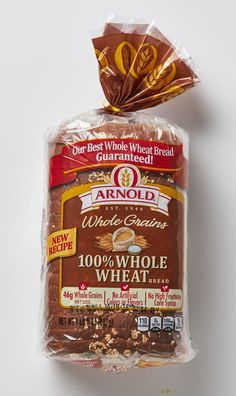 a bag of whole wheat bread sitting on top of a table