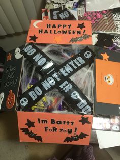 several halloween candy boxes are stacked on top of each other