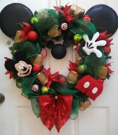 a mickey mouse christmas wreath on a door