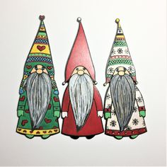 three gnomes are standing next to each other in front of a white background,