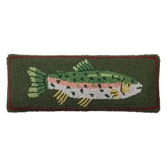 a green door mat with a fish on it