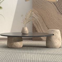 a table with two rocks on it in front of a wall