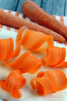 peeled carrots are on a cutting board