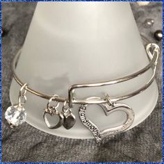 New Without Tags, Grandmother Expandable Double Loop Stainless Steel Bracelet Double Loop Expandable Wire Bangle With Grandmother On The Larger Heart Charm. This Expansion Bracelet Allows The Wearer To Smoothly Adjust The Bangle For A Perfect Fit. *Stainless Steel Split Rings Attach Charms To The Bangle Ensuring No Lost Charms *Completely Adjustable, One Size Fits All *Makes A Perfect Gift! *Never Been Worn, Comes With A Gift Box. There Is Nothing Wrong With This Itemjust Downsizing And All My I Adjustable Metal Heart Bracelet For Mother's Day, Adjustable Heart Bangle For Mother's Day, Adjustable Charm Bracelet For Mother's Day, Adjustable Metal Charm Bracelet For Anniversary, Adjustable Bracelet As Gift For Mom, Wire Bangles, Split Rings, Name Jewelry, No Name