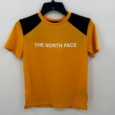 The North Face Boy's Never Stop Tee In Summit Gold Size Large New With Tags-Small Stain On Sleeve (See Picture, Washing Will Remove It) Please Feel Free To Ask Any Questions Before Purchasing Thank You! Yellow Sporty T-shirt With Letter Print, Yellow Sports T-shirt With Logo Print, Black The North Face Crew Neck T-shirt, The North Face Black Crew Neck T-shirt, The North Face Black Casual T-shirt, Black Crew Neck T-shirt By The North Face, Casual Black The North Face T-shirt, Black Casual T-shirt By The North Face, Casual Black T-shirt By The North Face