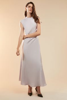 Sultry, elevated and entirely elegant, the Peggy A-line Slip Dress creates a fluid aesthetic that feels feminine and effortless. Made from a satin fabric, it features a high neckline, extended shoulders and an open back to draw the eye. SIZING: True to size. AU: Model wears a size 8 / US: Model wears a size 4.FABRICATION: Main: 100% polyester - A-line - High neckline - Open back Fluid Aesthetic, Corsets Fashion, Mum Jeans, Day To Night Dresses, White Cocktail Dress, Essential Dress, Bodysuit Fashion, Wide Jeans, Party Tops