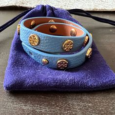 Tory Burch Leather Double Wrap Stud Bracelet With Push Closure. Never Worn. Dust Bag Included. Leather/Brass With Gold Plating. Approximate Measurement 15 3/8" Length; 1/2" Width. Wraps Around Most Wrists Twice Approx. 15 3/8"L. Everyday Blue Leather Jewelry, Elegant Blue Leather Bracelets, Adjustable Blue Leather Bracelets, Luxury Blue Bracelet Strap Watch Bands, Luxury Turquoise Cuff Bracelet With Inlay, Tory Burch Bangle, Tory Burch Navy Blue Bag, Luxury Leather Bracelet With Gold-tone Hardware, Tory Burch Jewelry