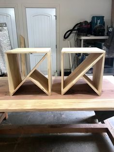 two pieces of wood sitting on top of a table