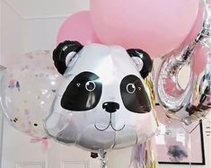 a panda bear balloon with balloons attached to it