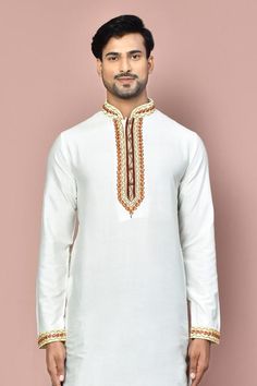 White full sleeve straight kurta with placement hand zardozi embroidery. Paired with a maroon dhoti pant.
Components: 2
Pattern: Placement Embroidery
Type Of Work: Zardozi
Neckline: Stand Collar
Sleeve Type: Full Sleeves
Fabric: Cotton
Color: White
Other Details: 
Embroidered cuffs on kurta
Occasion: Sangeet - Aza Fashions Navratri Bandhgala With Long Sleeves And Dabka Work, White Semi-stitched Long Sleeve Bandhgala, Traditional Kurta For Puja In Transitional Season, Ceremonial Kurta With Cutdana For Eid, Traditional Embroidered Kurta For Puja, Traditional White Nehru Jacket With Dabka, Ceremonial White Raw Silk Kurta, Traditional Nehru Jacket For Eid, Ceremonial Cutdana Kurta For Eid