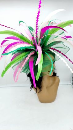 Extral Large multi-colored Green Fascinator. This is a show stopper!@ Beautiful headpiece for bridesmaids and a great accessory for a cocktail party or church outfit.  Comes with a pin or headband for an elegant but secure look. You may CHOOSE YOUR OWN COLORS - Headband  - Ready to ship  - Lightweight - Free Shipping - Fast shipping - Customize by adding different color flowers and or feathers Check my store for styles and colors.  Hatsandpearls.etsy.com Find more at my website: Www.hatsandpearls.com  Reach out to me if you can't find what you are looking for.  I can make cake custom orders and help you style and match your outfit  Tag and share your pictures when you wear and style our hats.  Instagram: @hats_pearls Facebook: Hats Pearls Thank you for visiting and happy shopping! Luxury Green Hat Band For Kentucky Derby, Multicolor Headband For Spring, Multicolor Spring Headband, Multicolor Mardi Gras Party Costume Hats And Headpieces, Multicolor Costume Hats For Mardi Gras Party, Multicolor Carnival Mini Hat Headband, Multicolor Carnival Headband Costume Hat, Multicolor Party Hat Headpiece, Multicolor Carnival Headband Costume