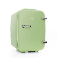 a green piece of luggage sitting on top of a white floor