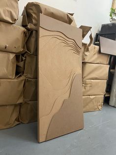 cardboard boxes are stacked on top of each other