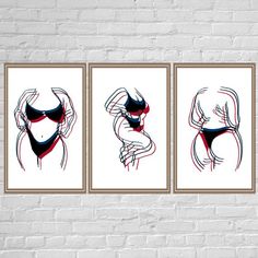 three framed art prints on a brick wall, each with a woman's torso