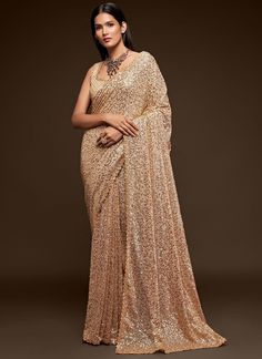 Take on the adventure of fashion with this Cream Designer Georgette Party Wear Saree! Adorned with attractive sequins and thread, this saree is perfect for festive occasions and receptions. Comes with a stylish blouse, making it a great gift for your girlfriend. Dare to stand out! The unstitched blouse can be customized upto 42 inches. Do Note: All the accessories shown are for styling purpose only. Slight color variation may occur due to photographic reasons. Fall and Pico : Done Draping Saree( Beige Saree, Sequins Saree, Georgette Material, Sequence Saree, Olive Green Blouse, Sequin Saree, Party Sarees, Party Wear Saree, Red Lehenga