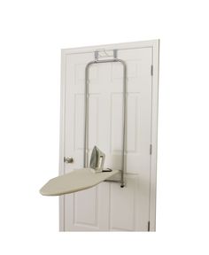 an ironing board mounted to the side of a door