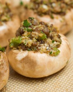 stuffed mushrooms with various toppings sitting on a table