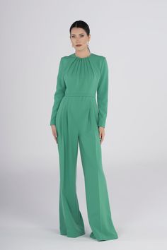 Elevate your style with our Chic Green Jumpsuit, designed for those special occasions where elegance is a must. The pleated-wide leg trousers add a touch of sophistication, making it perfect for proms, weddings, and any other memorable event. Pleated Fitted Jumpsuits And Rompers For Party, Elegant Fitted Pleated Jumpsuits And Rompers, Elegant Pleated Jumpsuits And Rompers For Party, Formal Fitted Full-length Jumpsuit/romper, Elegant Fitted Jumpsuits And Rompers For Wedding, Elegant Fitted Jumpsuit For Wedding, Elegant Long Sleeve Suits For Gala, Elegant Fitted Jumpsuit For Wedding Guest, Elegant Green Formal Jumpsuits And Rompers