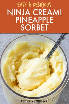 an ice cream in a cup with a spoon inside and text overlay that reads easy & delicious ninja cream pineapple sorbet