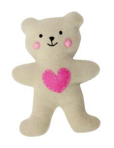 a white teddy bear with a pink heart on its chest