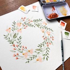 an art project with watercolor paints and flowers