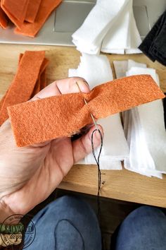 someone is making something out of felt with scissors